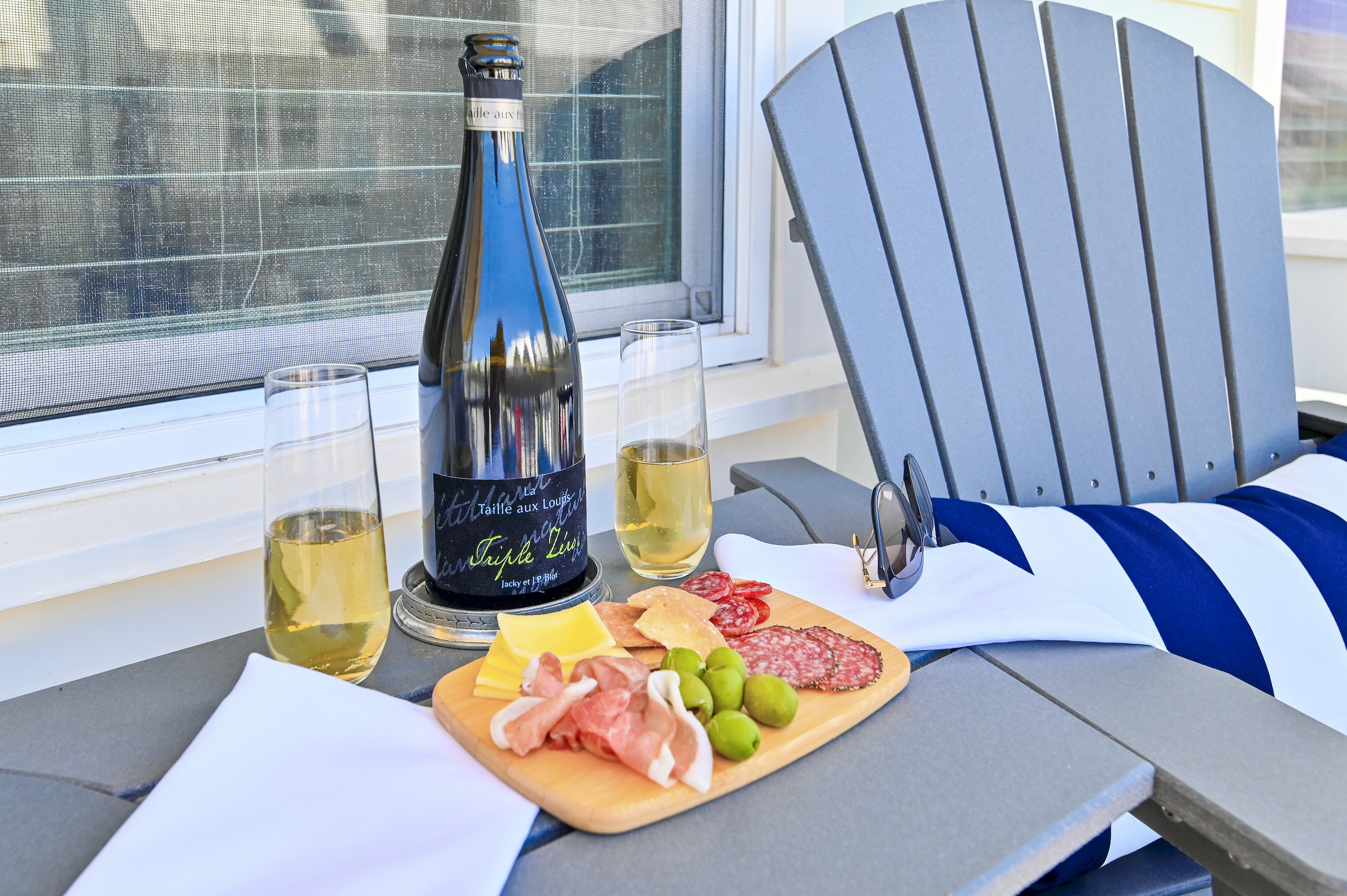 A bottle, two glasses